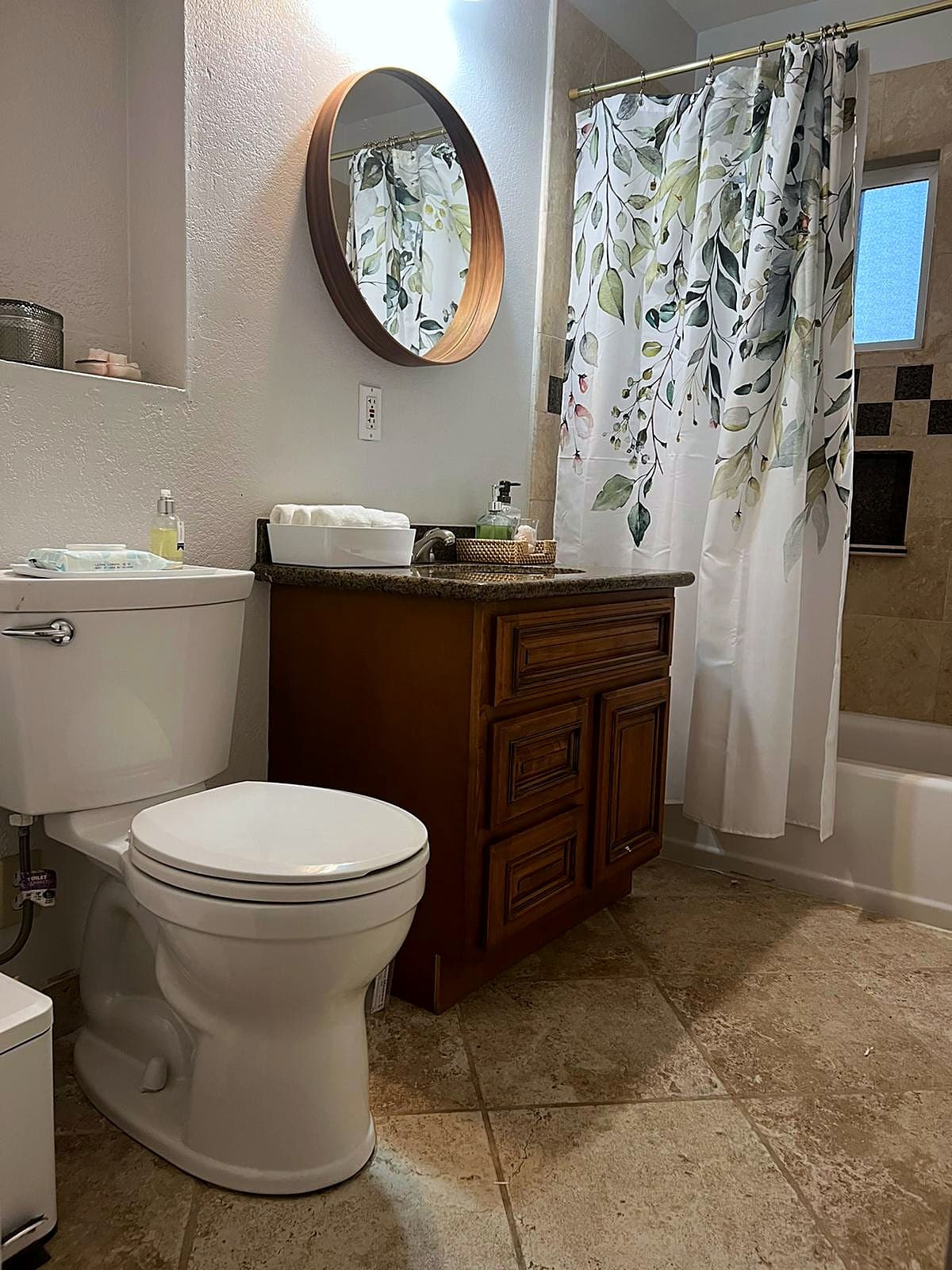 Private bathroom with bathtub and shower