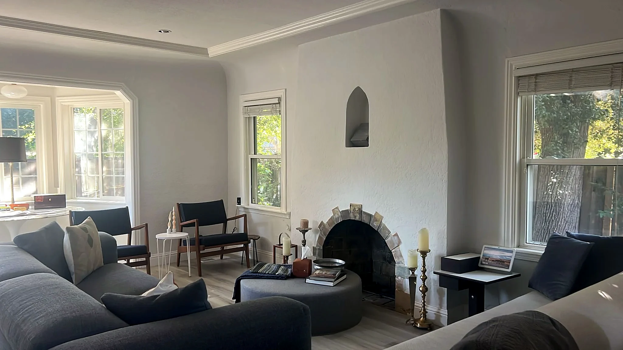 The living room with its arched fireplace
